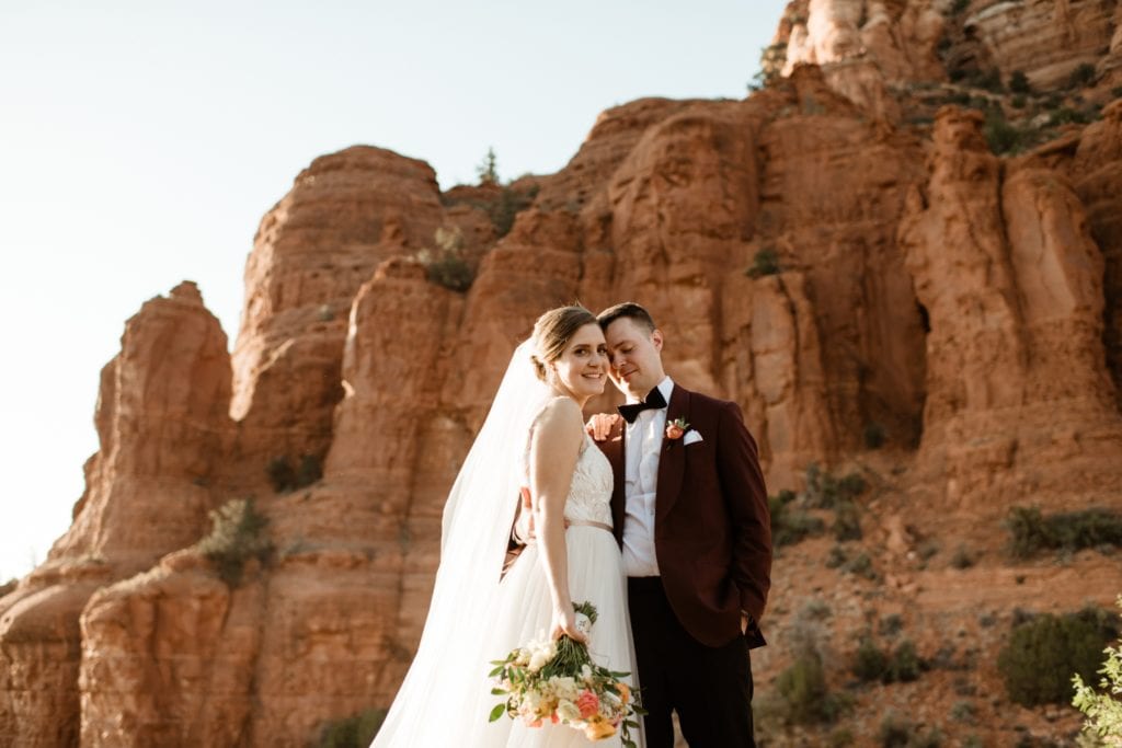 bride and groom after a wedding at the chapel of the holy cross in sedona arizona