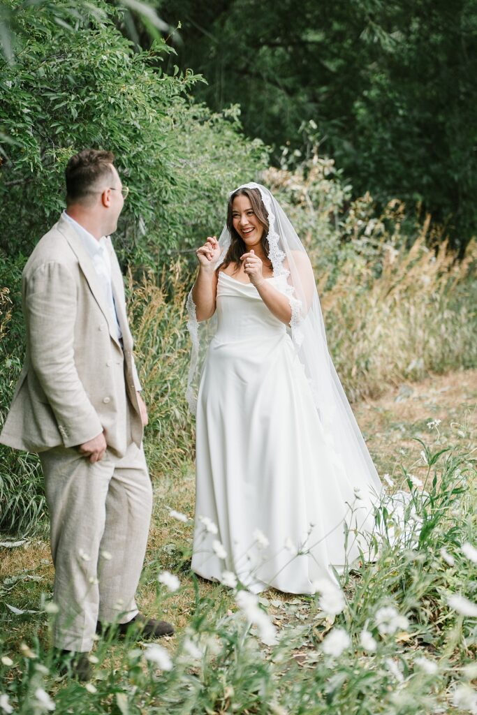 a bride and groom do a first look before their Boulder Flower Farm wedding