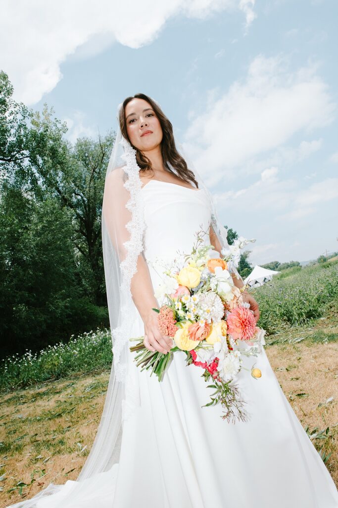 a bride on her wedding day before her Boulder Flower Farm wedding