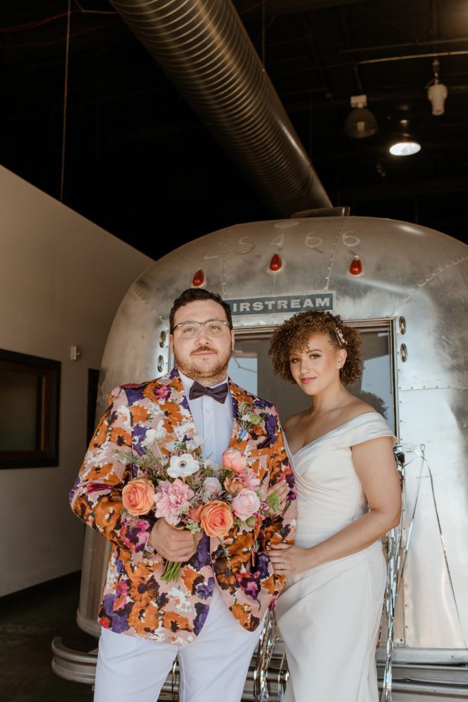 bride and groom in front of airstream at the Studio Boulder wedding venue