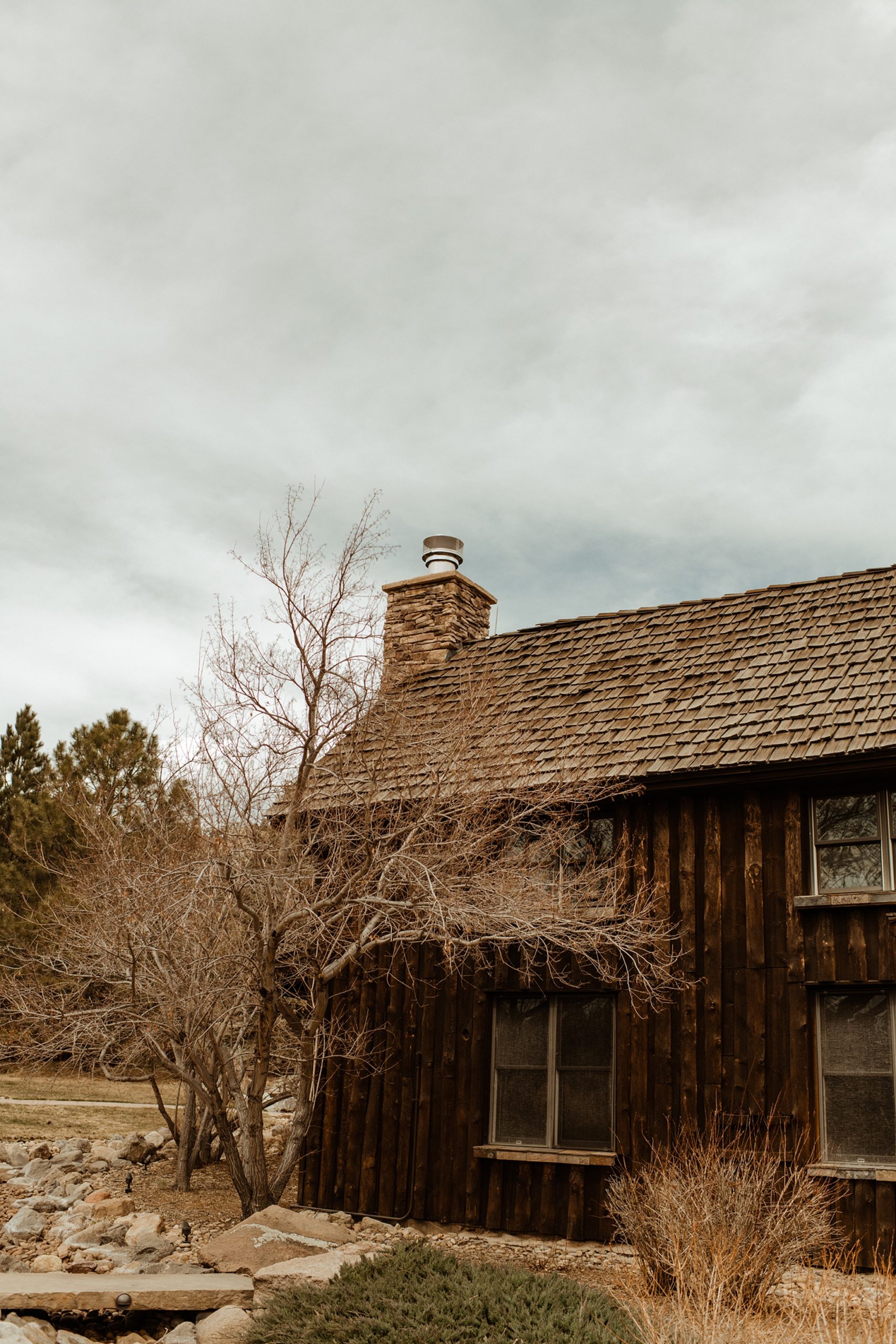 The exterior of the Colorado Room at Spruce Mountain Ranch in the springtime