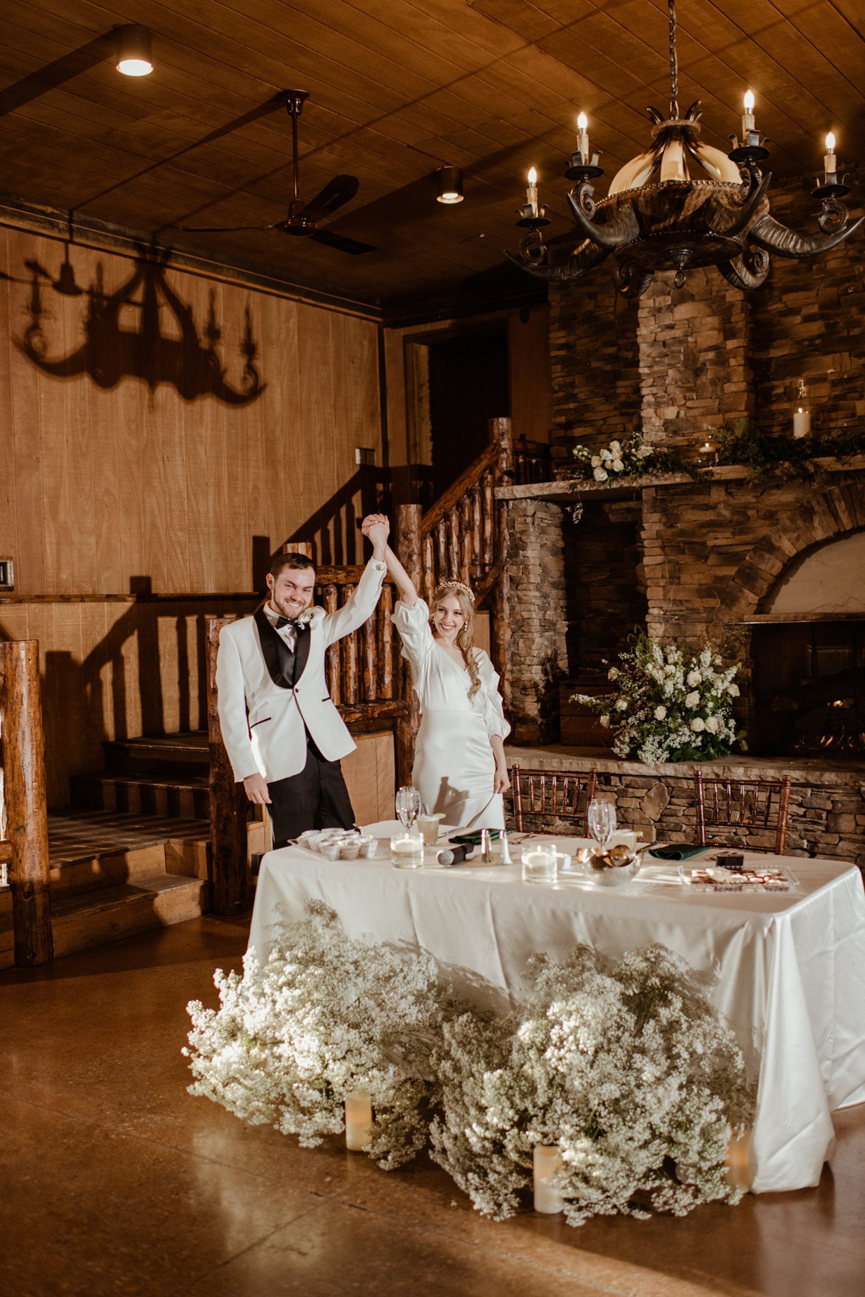 bride and groom enter the reception area at Albert's Lodge Wedding venue