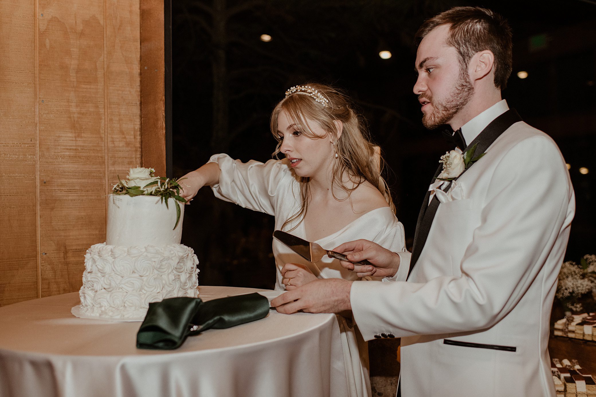 bride and groom cutting into their cake at Albert's Lodge Wedding venue