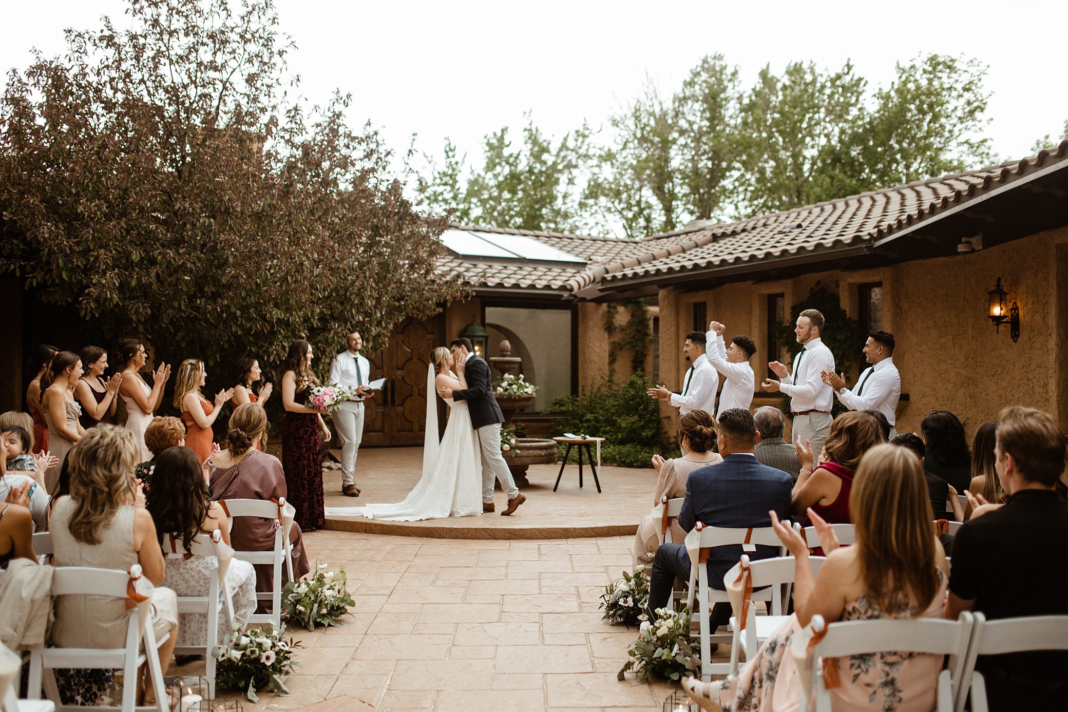 First kiss during an outdoor ceremony at Villa Parker