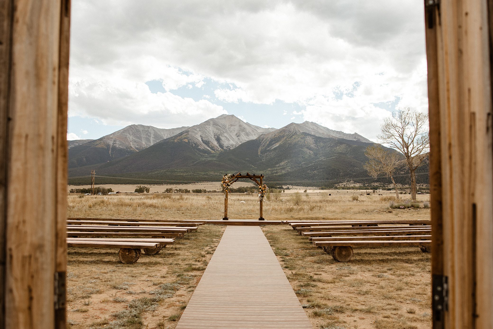 The ceremony sit at The Barn at Sunset Ranch in Buena Vista, Colorado