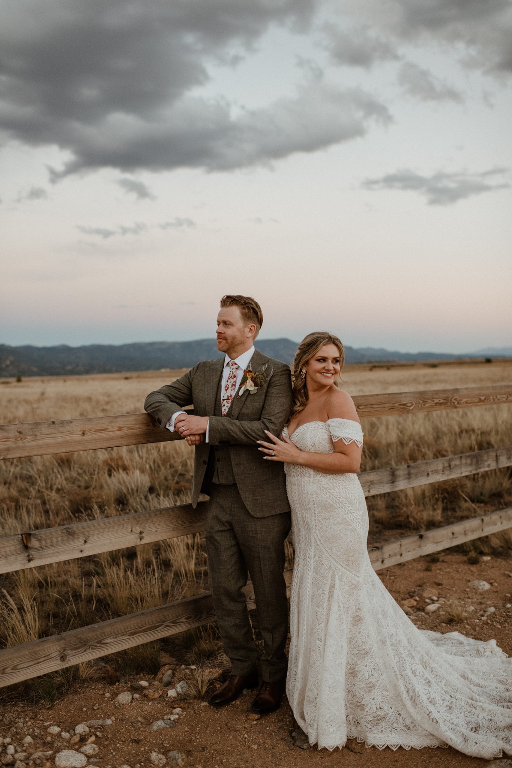 A bride and groom at sunset at the Barn at Sunset Ranch wedding venue