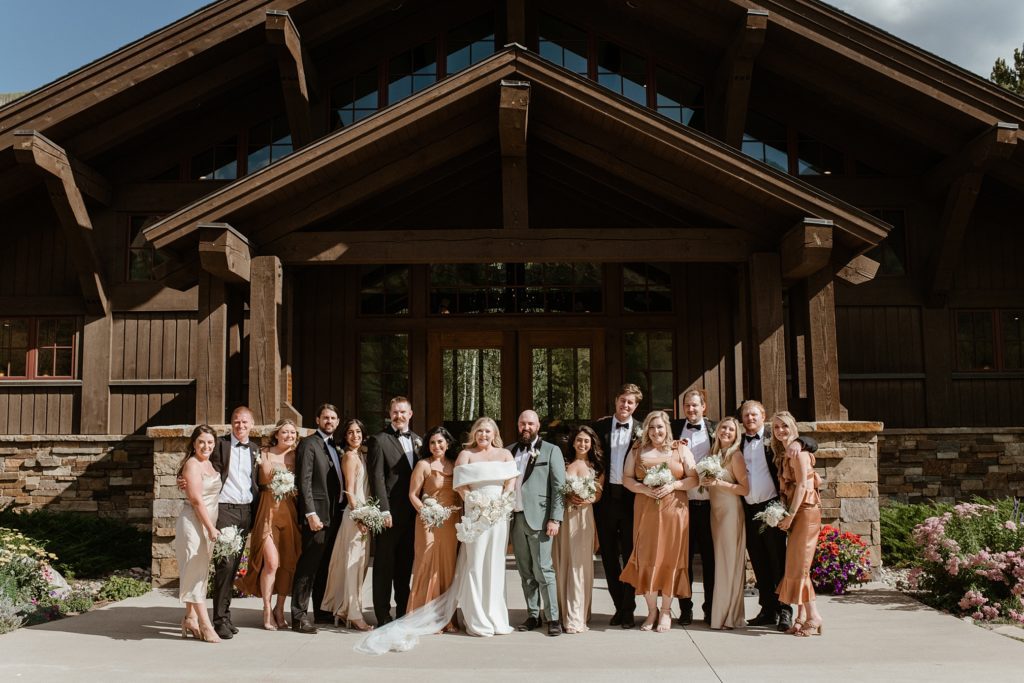 A wedding party stands in front of the Donovan Pavilion