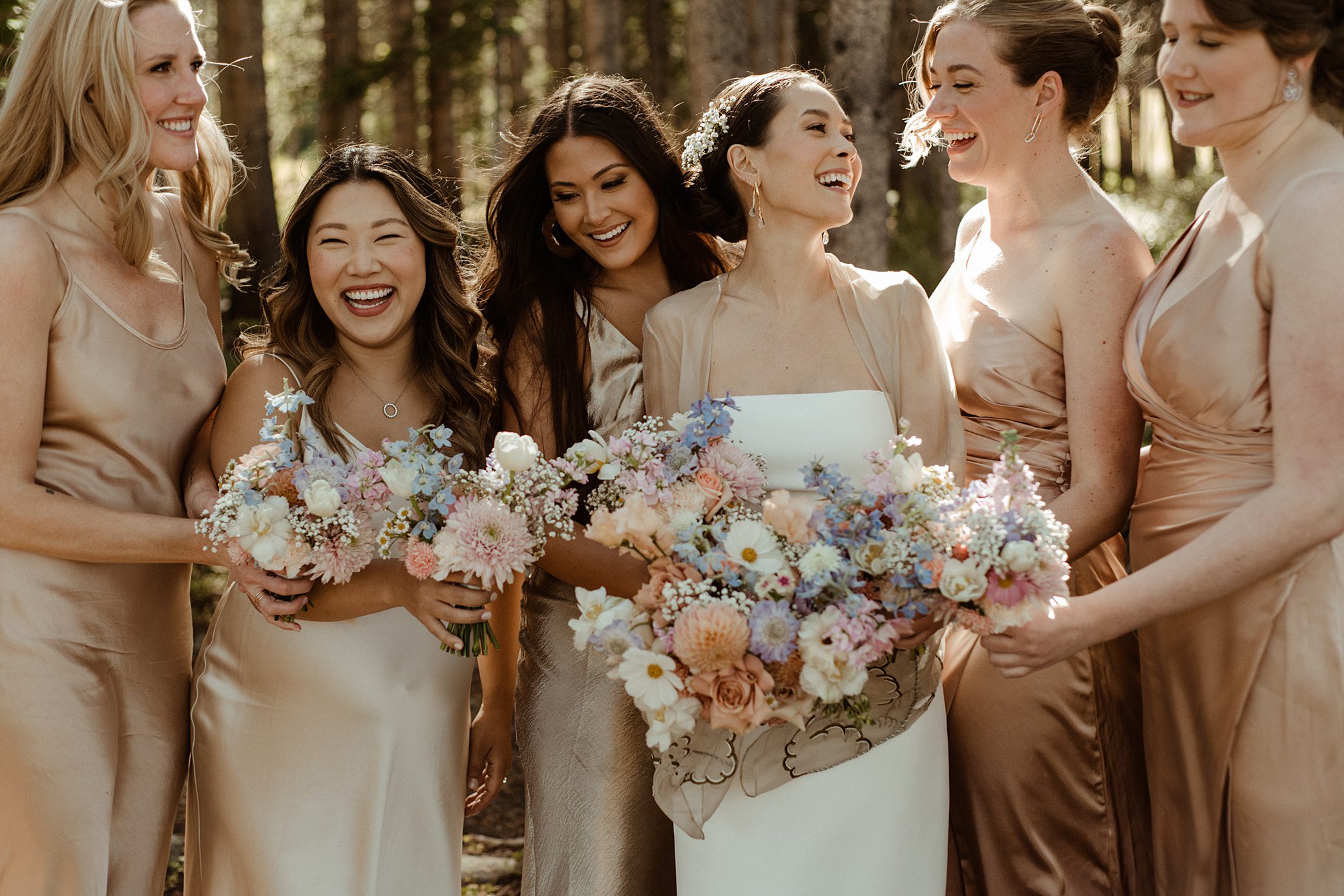 bridesmaids in the woods atTen Mile Station wedding venue