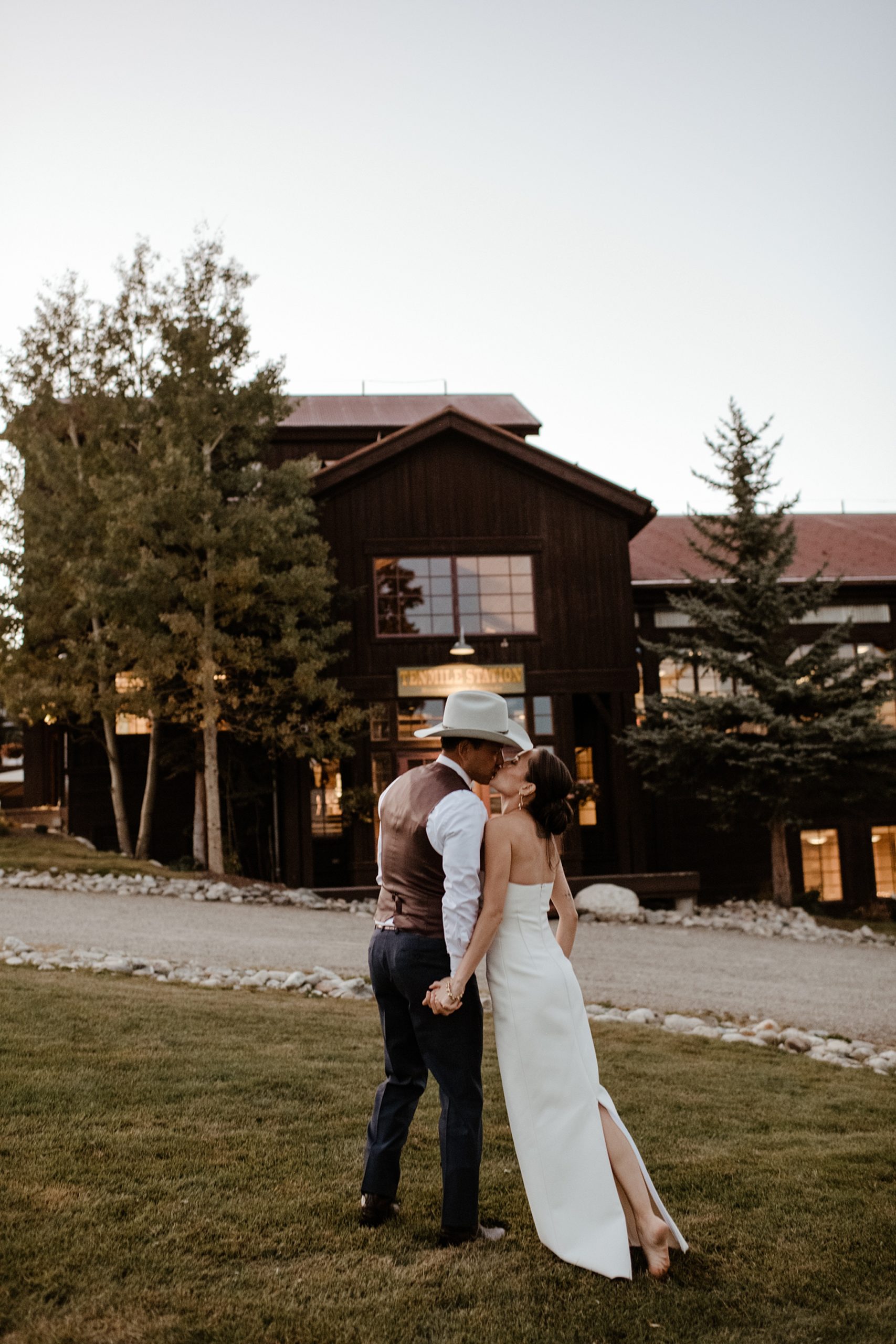 A bride and groom in front of Ten Mile Station wedding venue