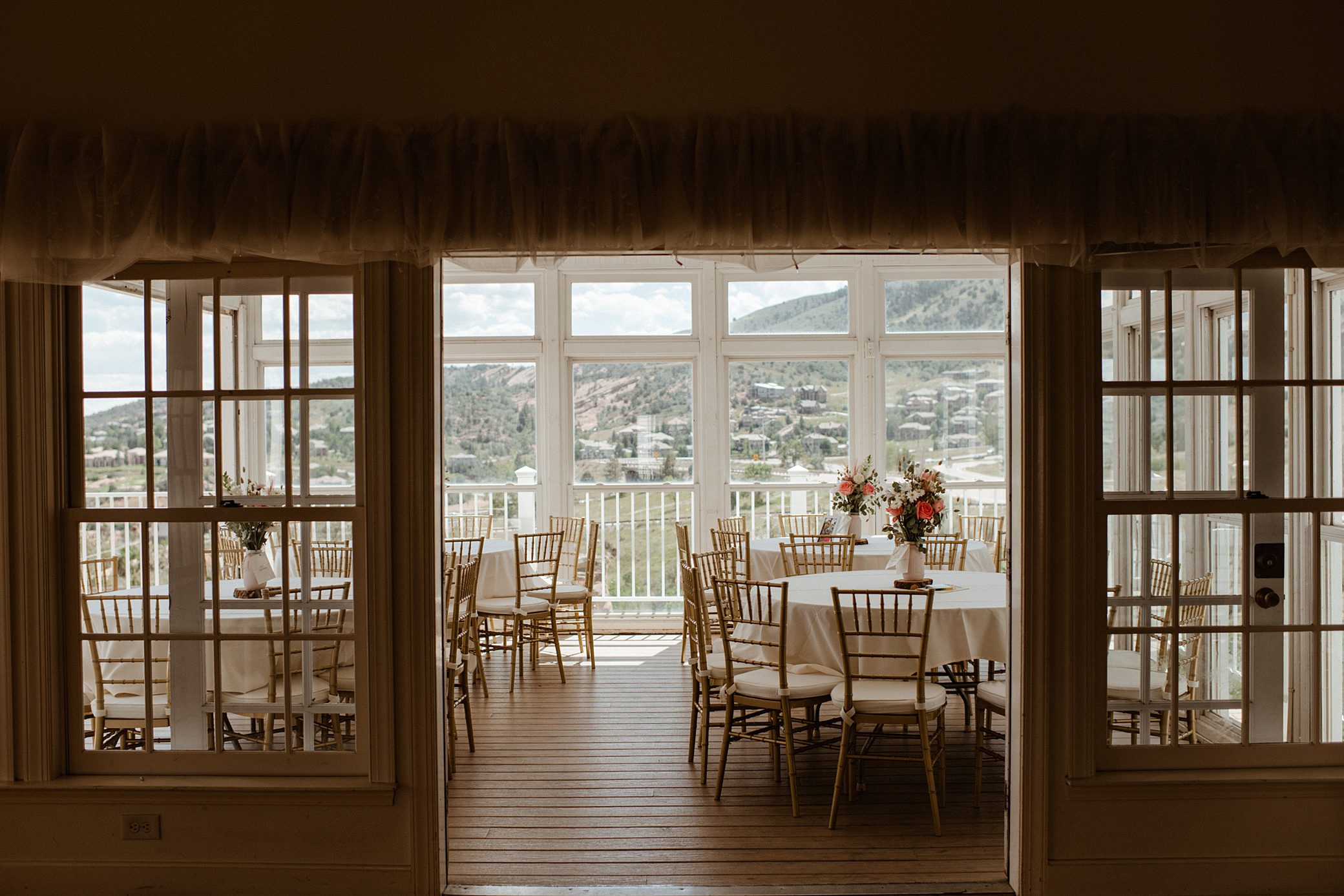 On the patio of the reception ballroom at Willow Ridge Manor wedding venue in Morrison, CO