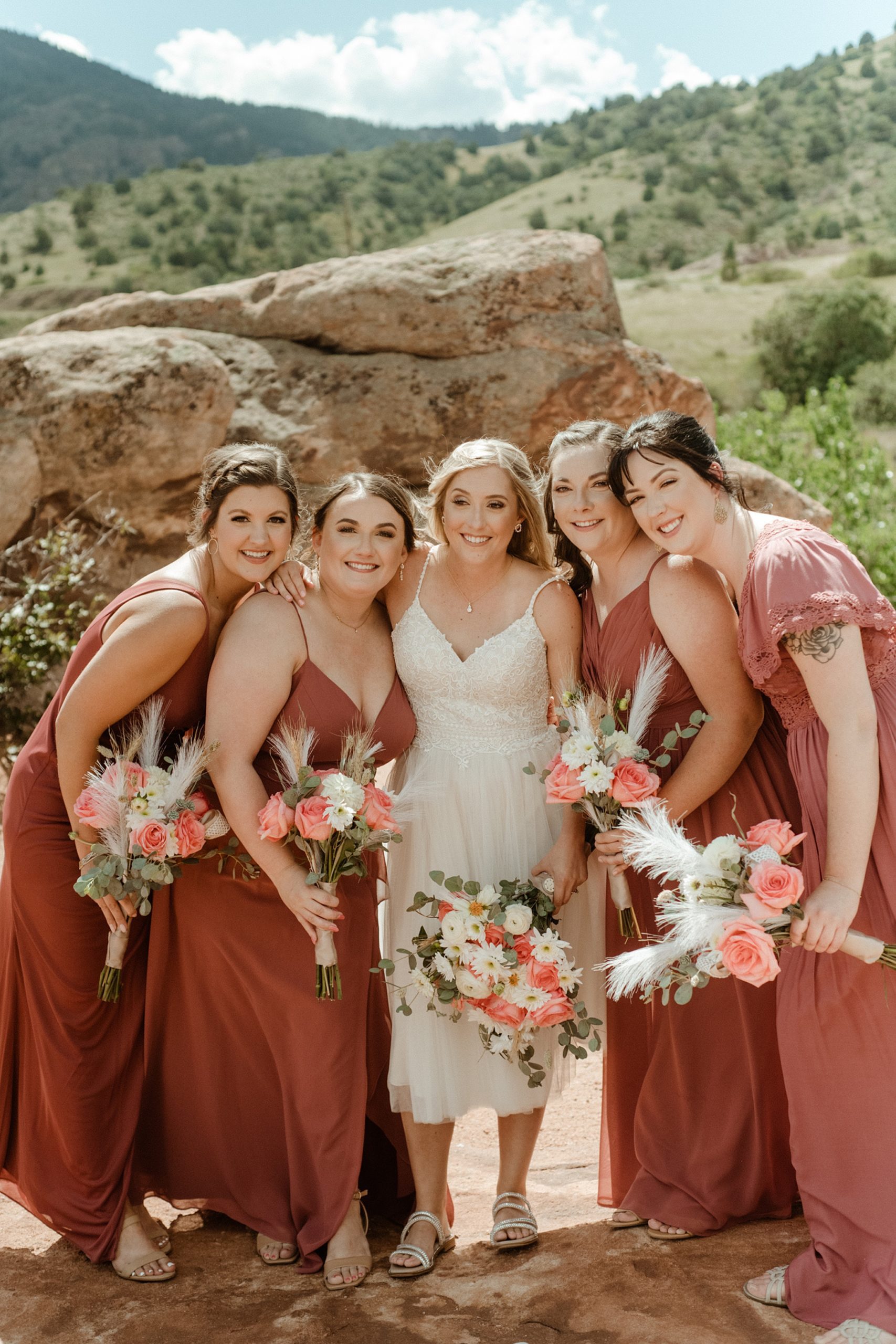 Bridesmaids out on the red rocks at Willow Ridge Manor wedding venue in Morrison, CO