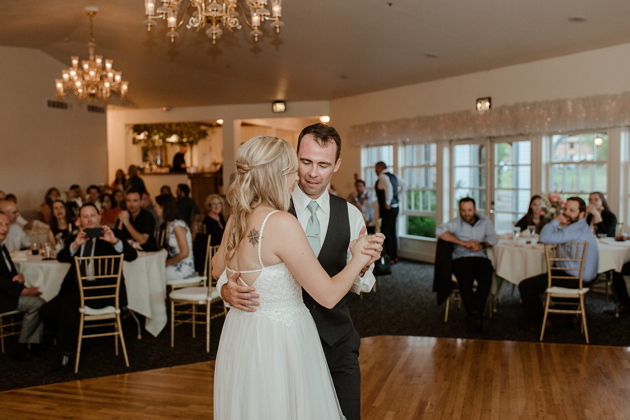 A bride and groom have their first dance at Willow Ridge Manor wedding venue in Morrison, CO