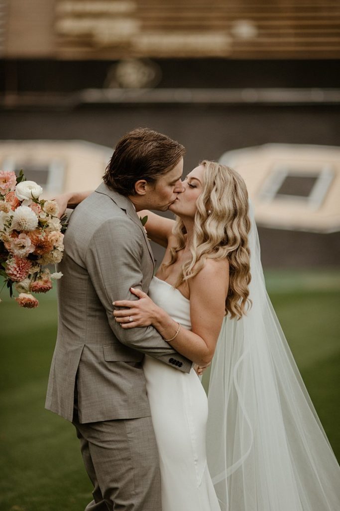 First look on the field at Folsom Field Events Wedding venue in Boulder, Colorado