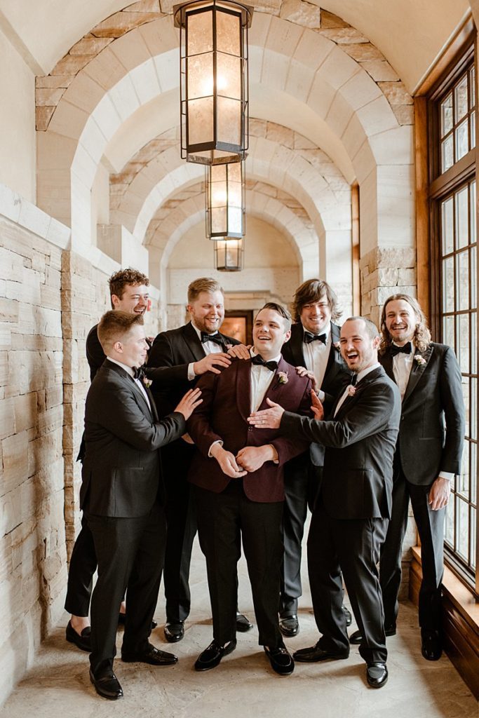 a groom and groomsmen at a Sanctuary Golf Course Wedding