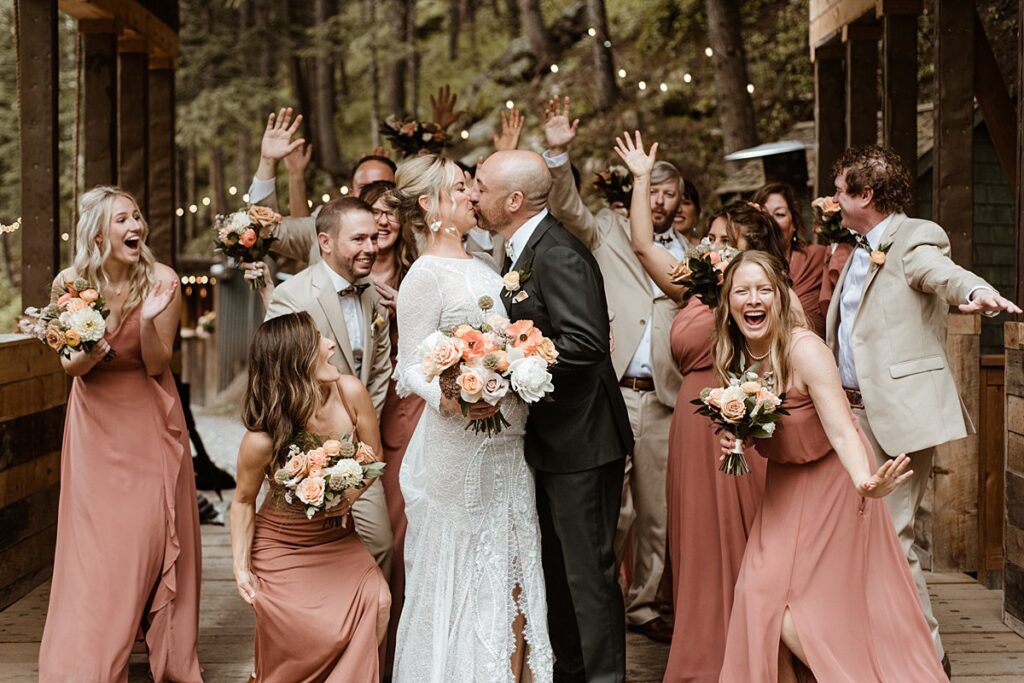 a wedding party on the covered bridge at the Blackstone Rivers Ranch wedding venue