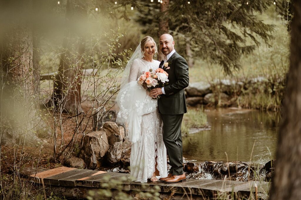 a bride and groom in the woods on their wedding day at Blackstone Rivers Ranch