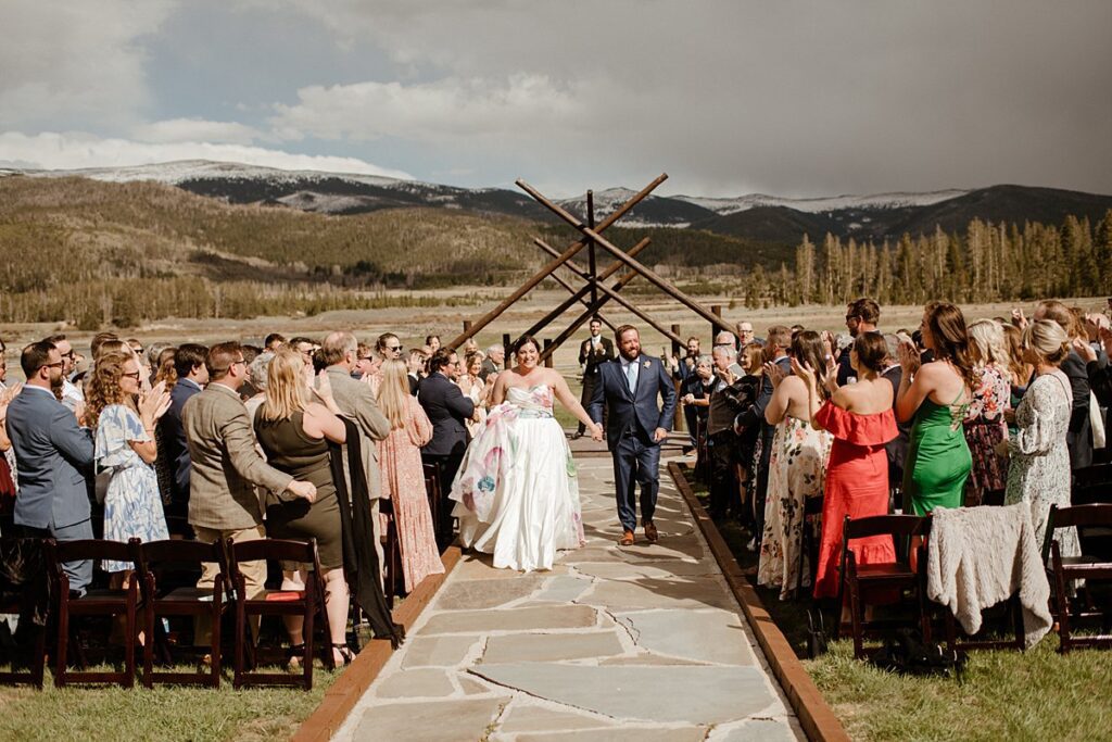 a couple just finished say "i do" at their Devil's Thumb Ranch wedding venue
