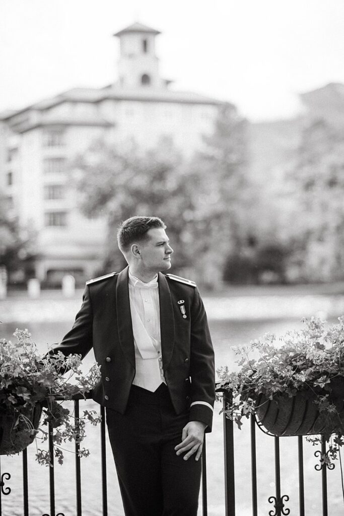 a groom waiting for his bride outside of the Broadmoor Hotel