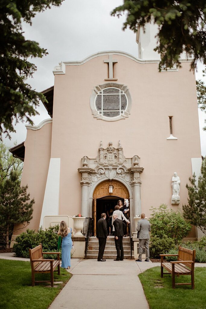 wedding guests enter the Pauline Chapel at the Broadmoor Resort