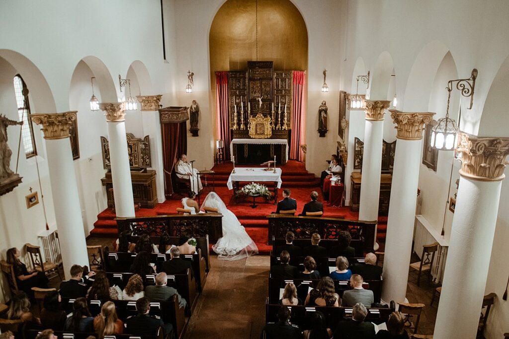 a traditional wedding ceremony inside of the Pauline Chapel at the Broadmoor in Colorado Springs