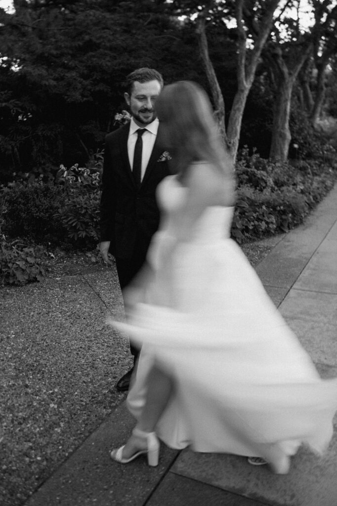 a bride and groom walk around the Denver Botanic Gardens during their Annuals Garden and Pavilion wedding 