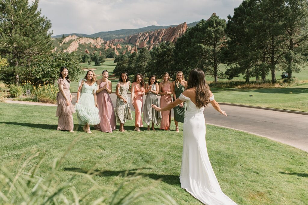 a bride surprises her bridesmaids with a first look before her Arrowhead Golf Course wedding