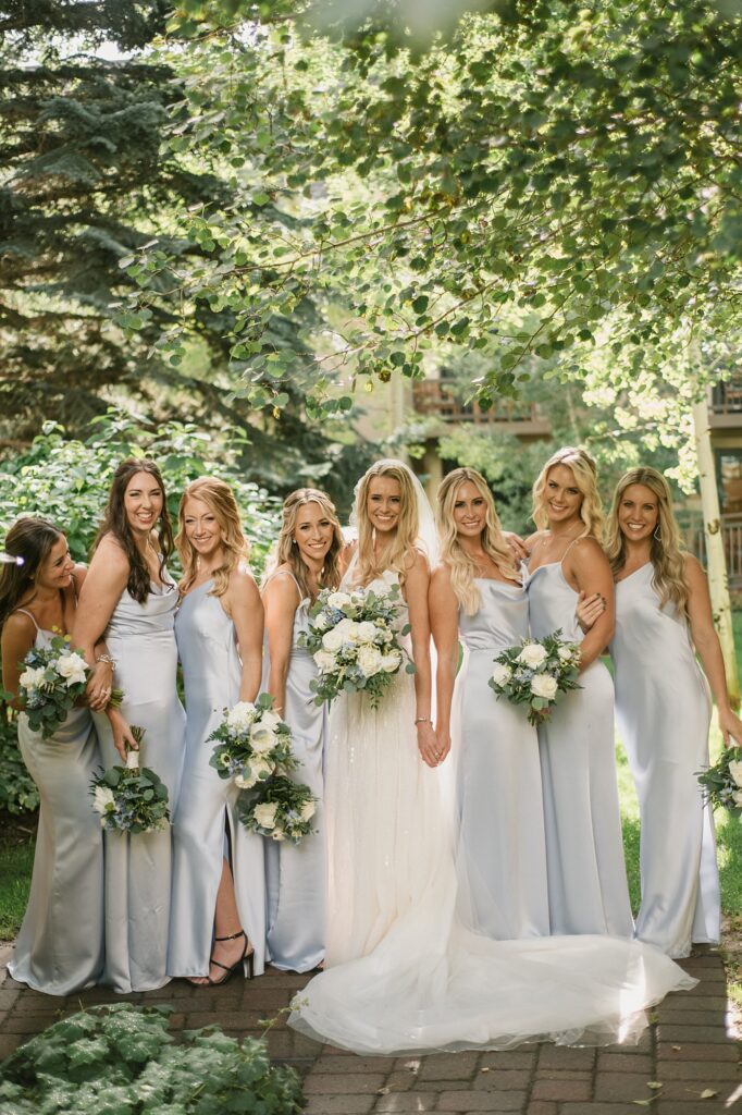 a bride and her bridesmaids in the aspens before her Four Seasons Vail wedding
