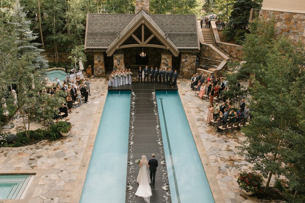 An overlook of a Four Seasons Vail wedding ceremony over the pool
