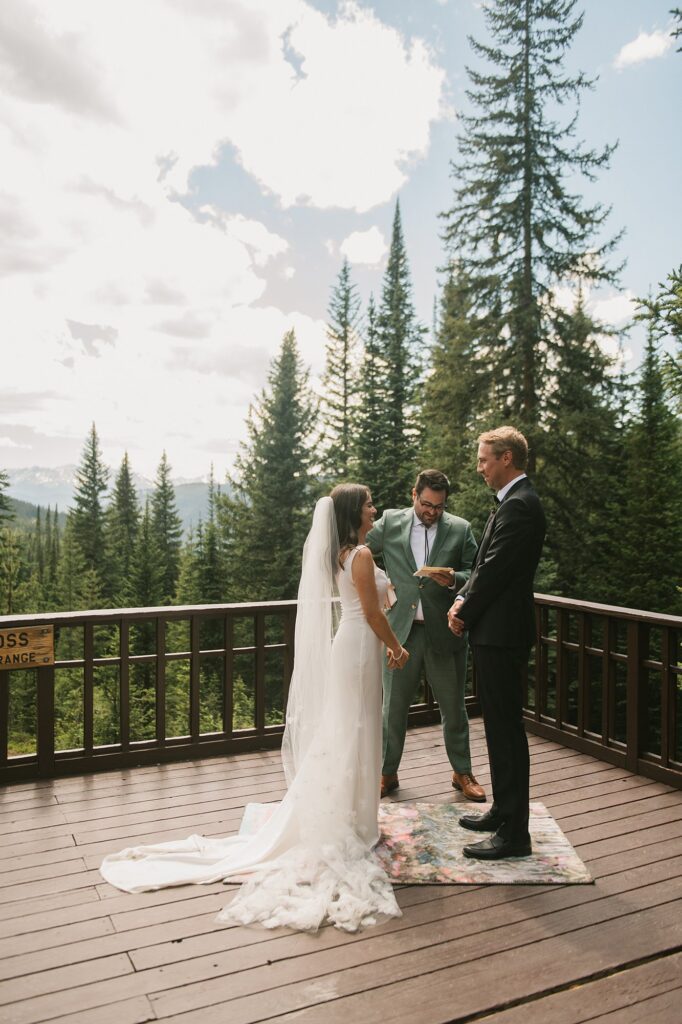 a bride and groom have an intimate wedding ceremony with their close family in attendance at Julia's Deck