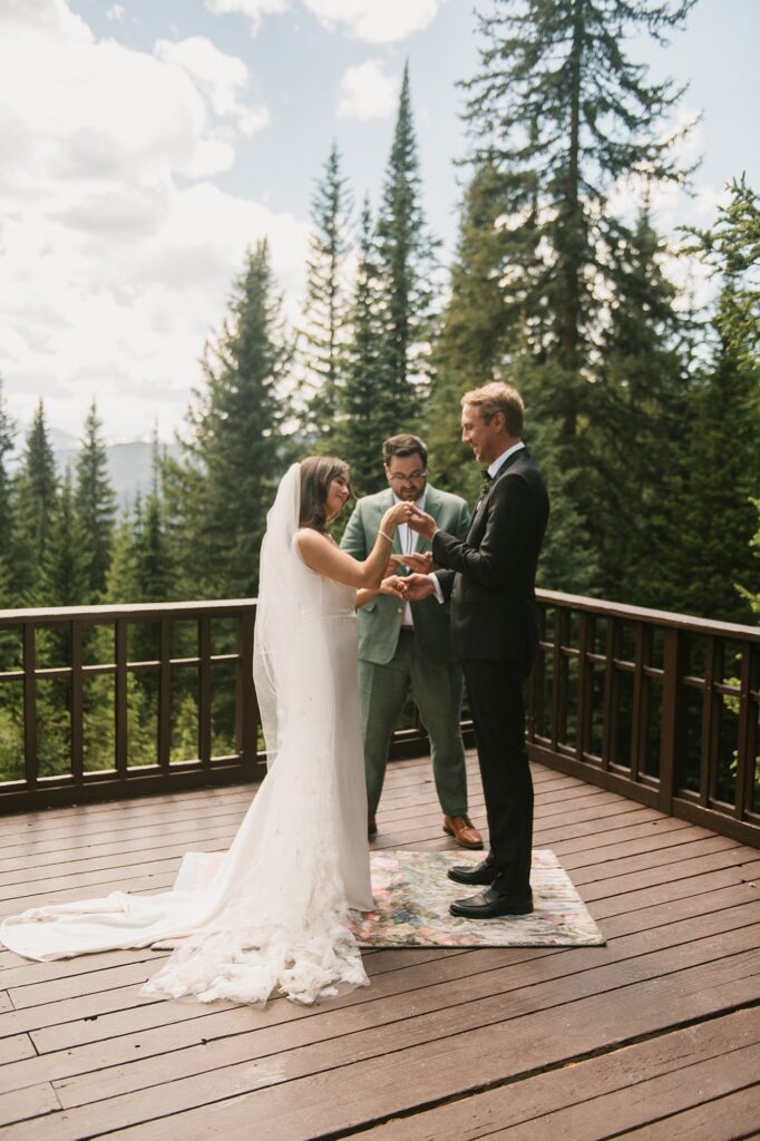 a bride and groom have an intimate wedding ceremony with their close family in attendance at Julia's Deck