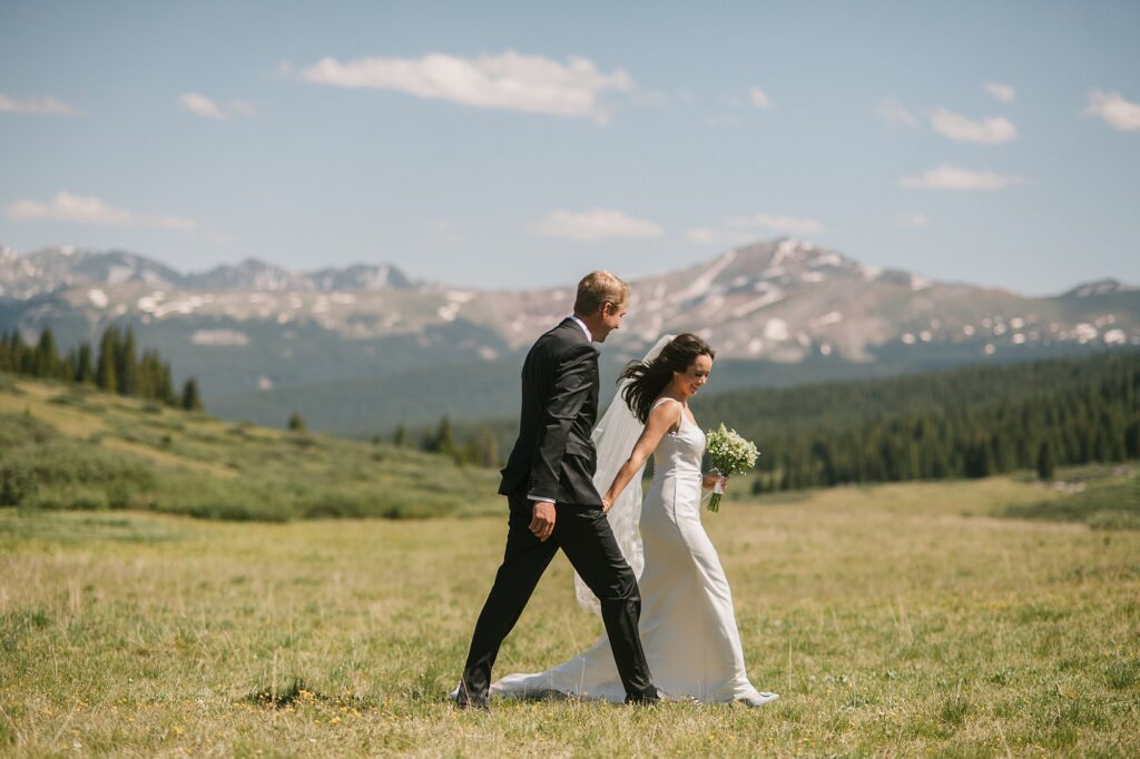 a bride and groom have an intimate wedding ceremony with their close family in attendance up on Shrine Pass in Vail, CO