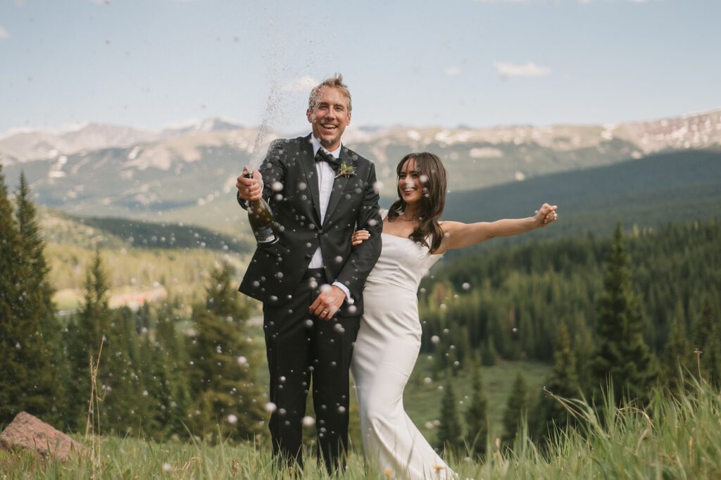 a bride and groom have an intimate wedding ceremony with their close family in attendance up on Shrine Pass in Vail, CO