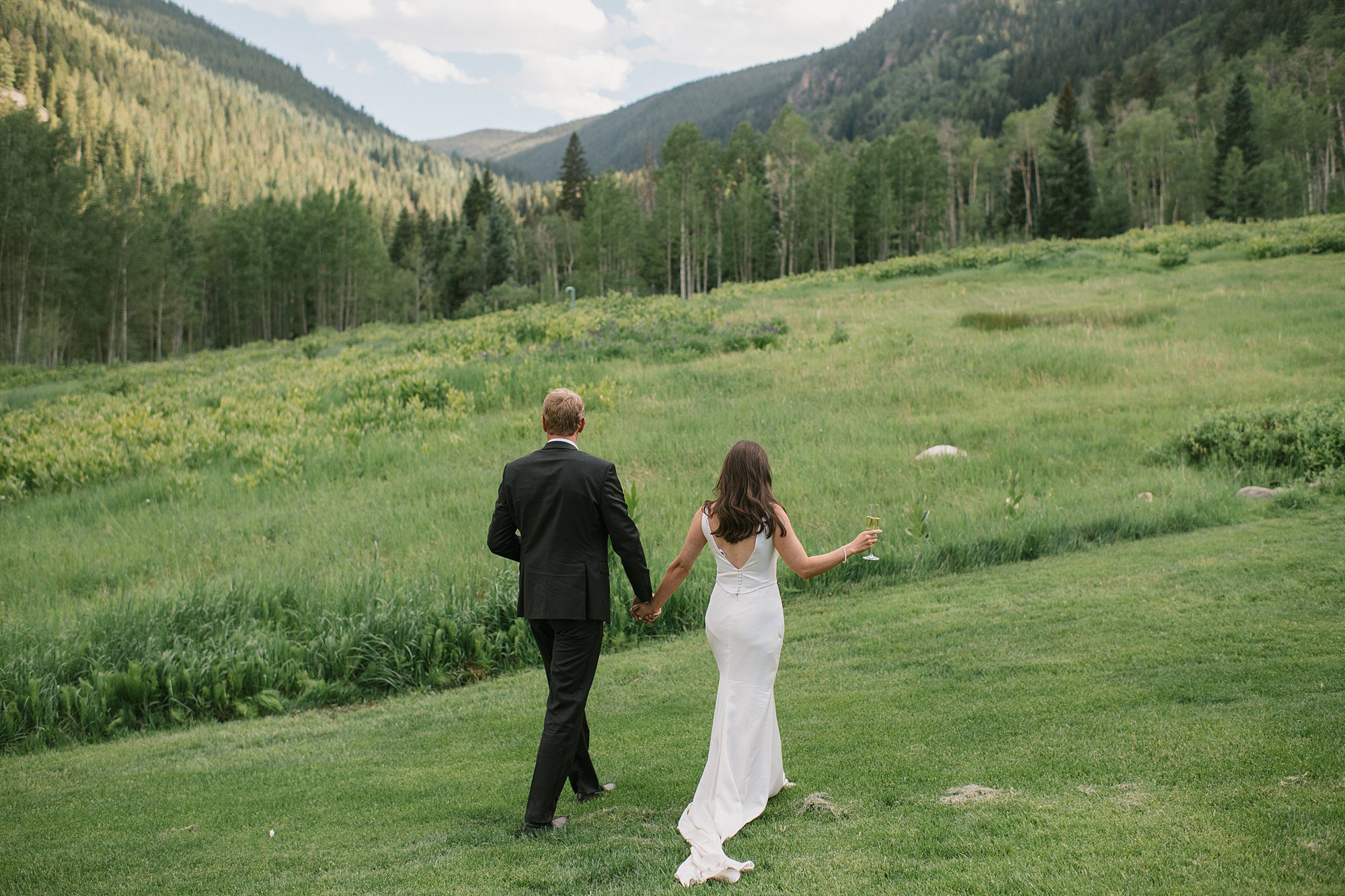 A bride and groom enjoy the scenery at Beano's Cabin after the intimate Beaver Creek wedding