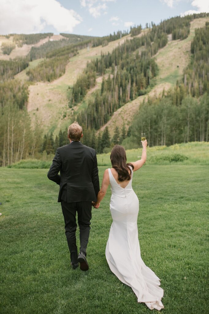 a bride and groom celebrate their intimate wedding with their family up at Beano's Cabin in Beaver Creek, CO