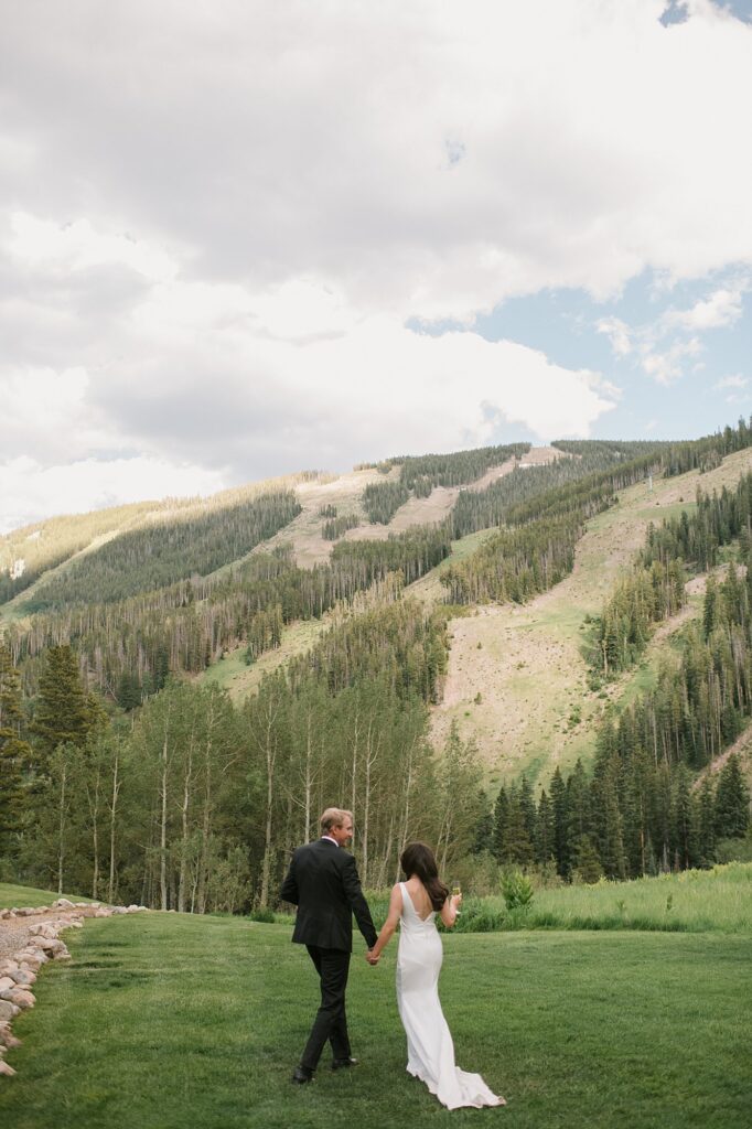 a bride and groom celebrate their intimate wedding with their family up at Beano's Cabin in Beaver's Creek, CO