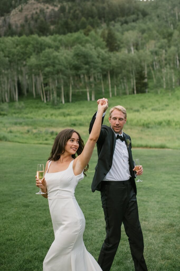a bride and groom celebrate their intimate wedding with their family up at Beano's Cabin in Beaver's Creek, CO