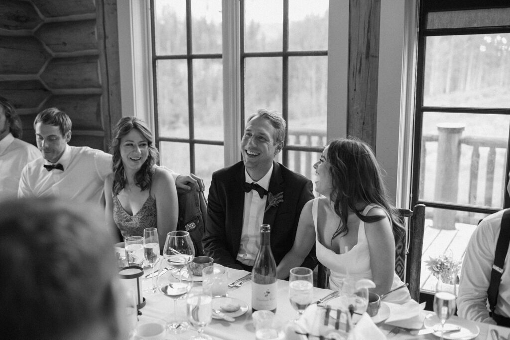 a bride and groom celebrate their intimate wedding with their family up at Beano's Cabin in Beaver Creek, CO