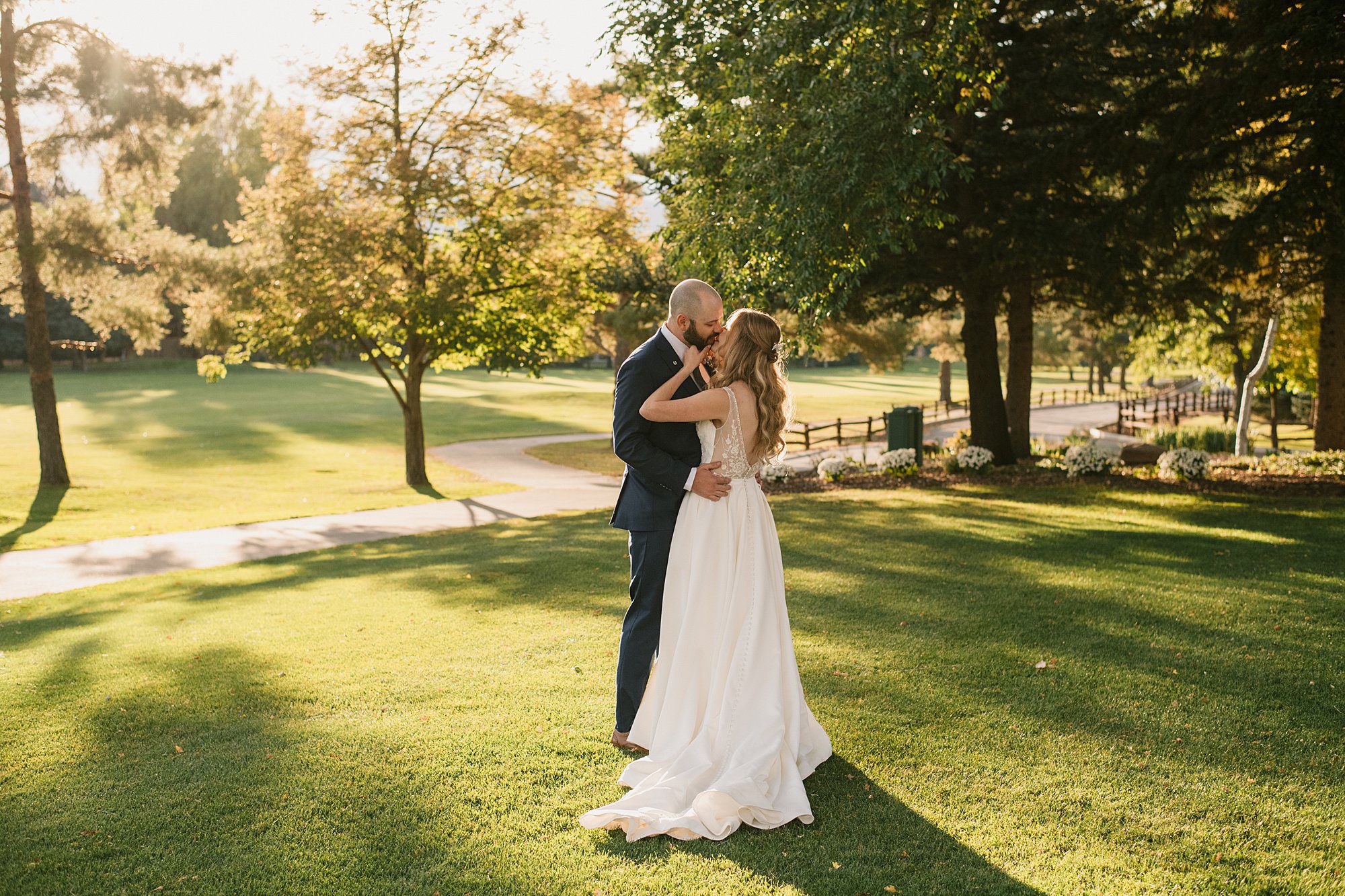 A bride and groom on the green at their Boulder Country Club wedding