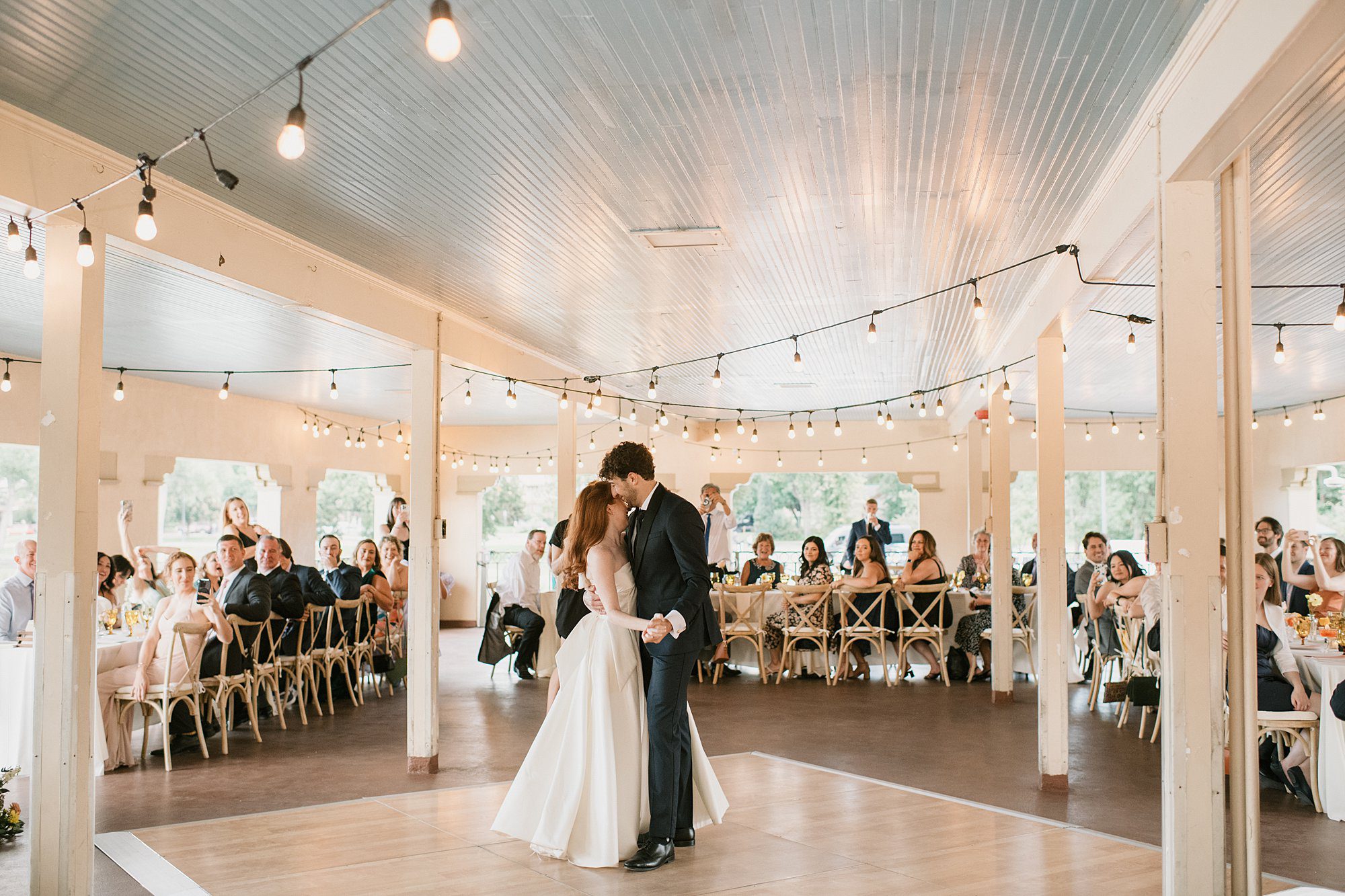 a bride and groom share their first dance during their Washington Park Boathouse wedding in downtown Denver