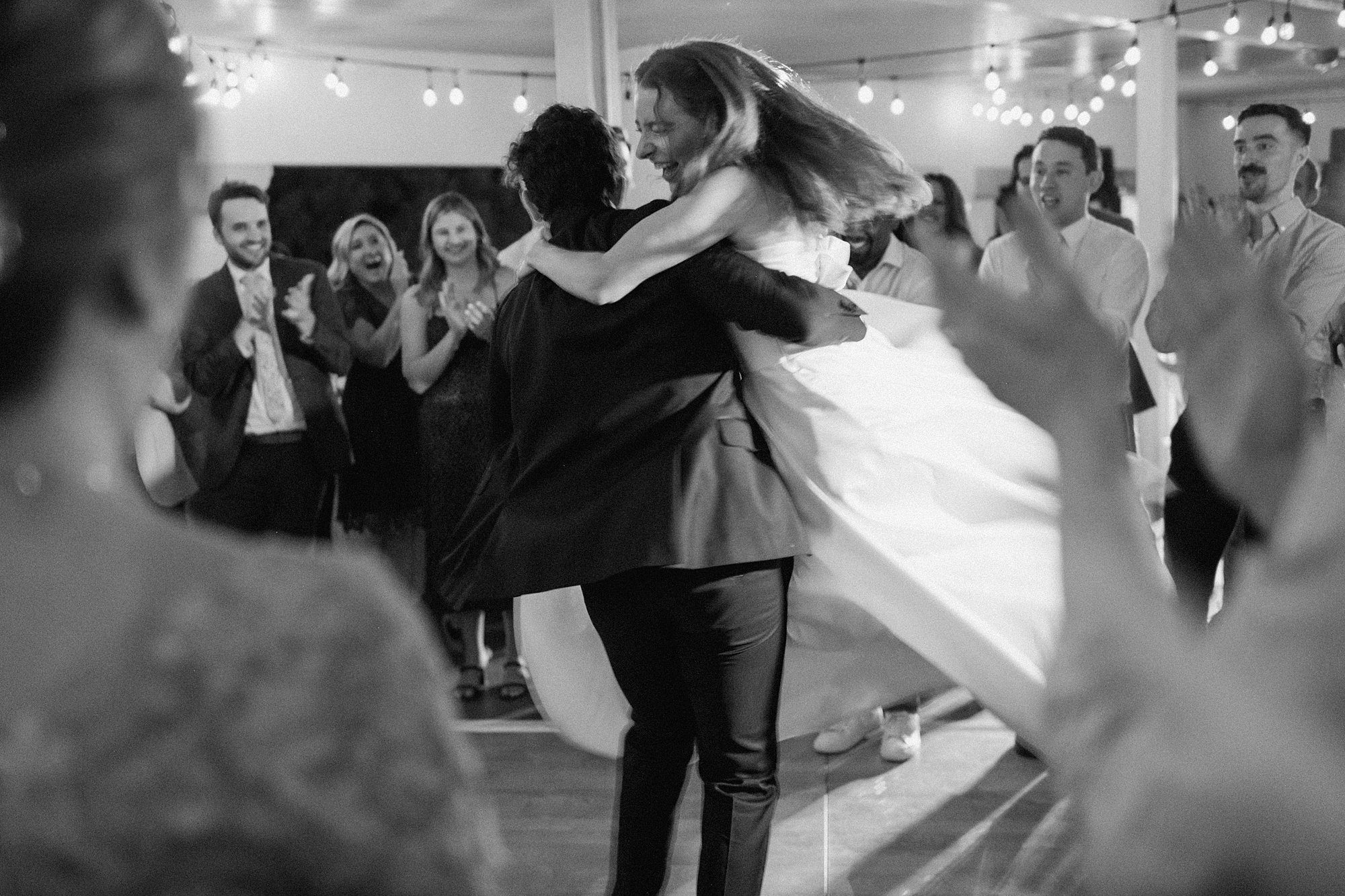 a couple dances the night away for their Washington Park Boathouse wedding reception