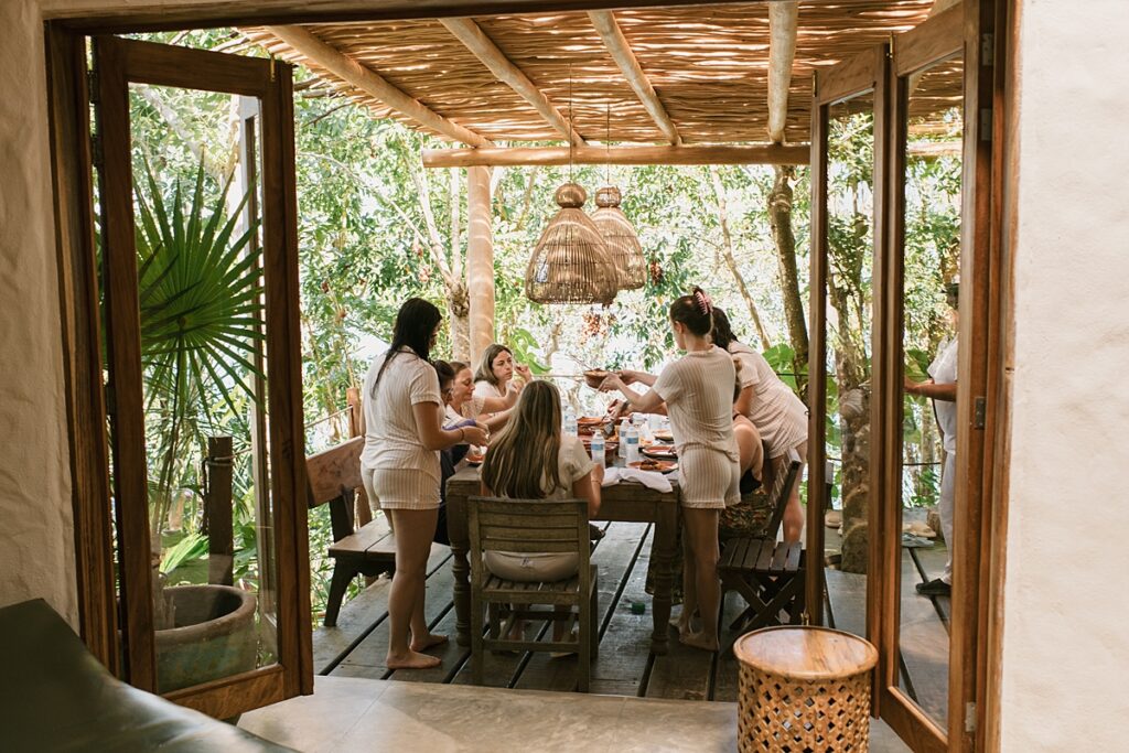 the bride and her bridesmaids eat breakfast at this private island mexico wedding venue