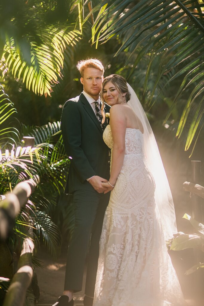 a bride and groom in the jungle of a private island mexico wedding venue
