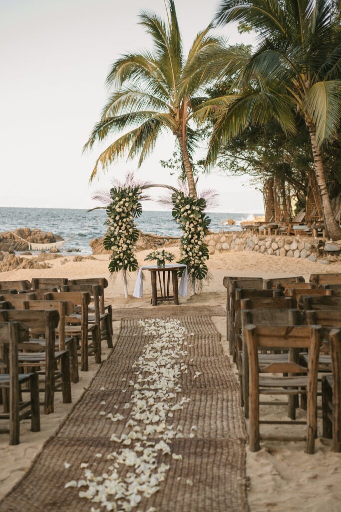 a tropical wedding ceremony setup at this private island mexican venue