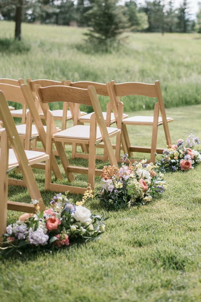 Spring florals are set up before a Lower Spruce Mountain Ranch ceremony