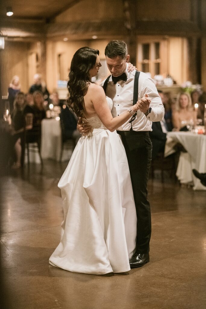 a bride and groom share their first dance at their Lower Spruce Mountain Ranch wedding reception