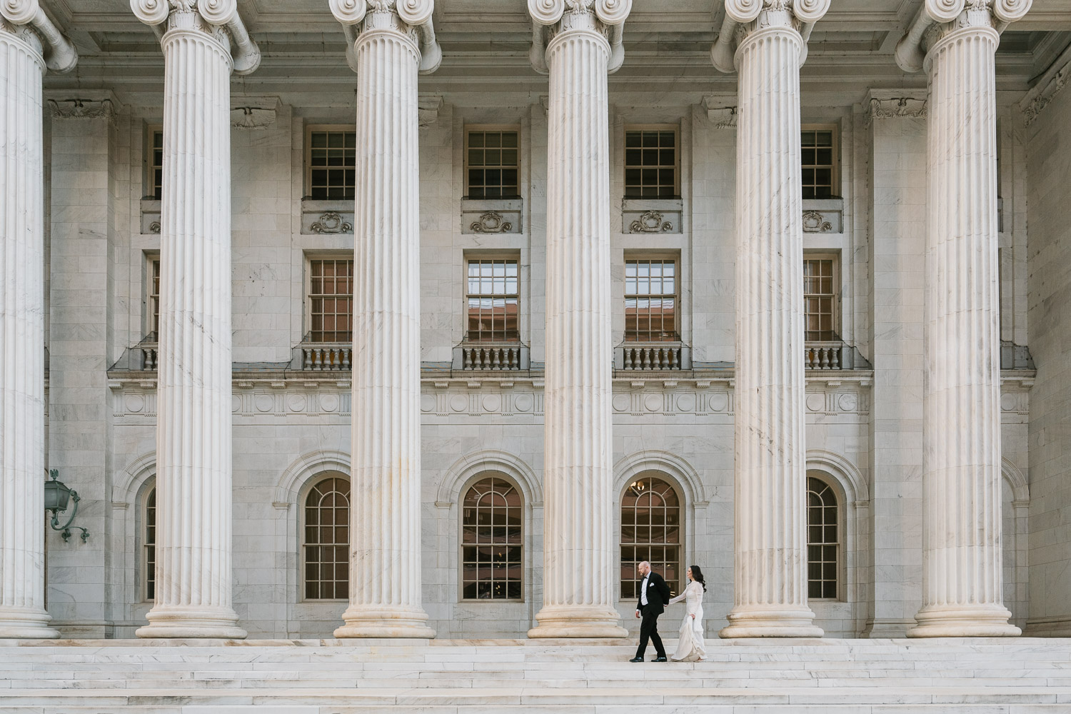 a Denver courthouse wedding with white columns and unique architecture