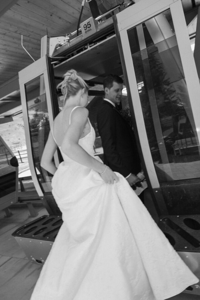 a bride and groom take Gondola One up to the top of the mountain before their Sonnenalp Hotel wedding