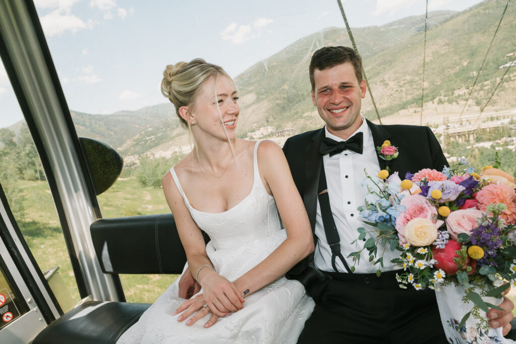 a bride and groom in the gondola before their Sonnenalp Hotel wedding