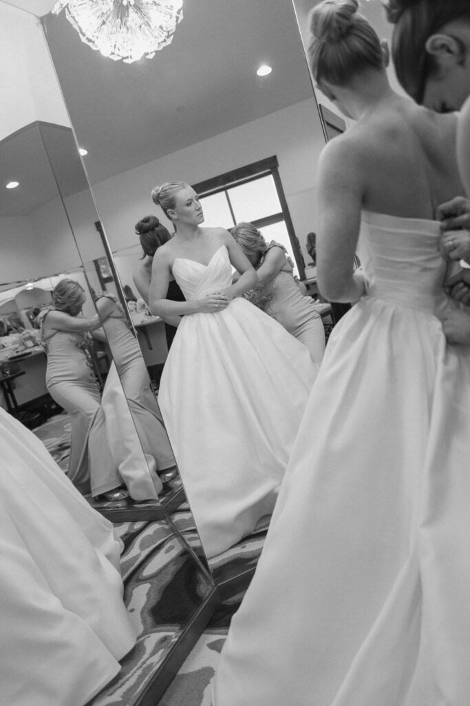 a bride gets ready in the bridal suite for a TPC Colorado wedding
