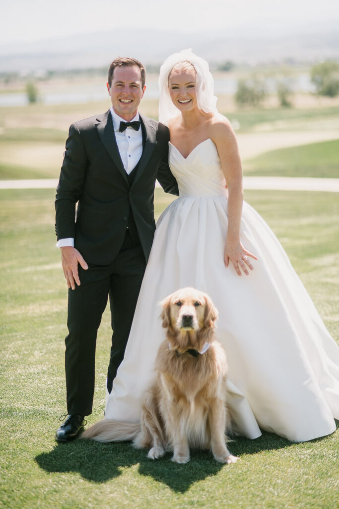 a bride and groom on the green before their TPC Colorado wedding